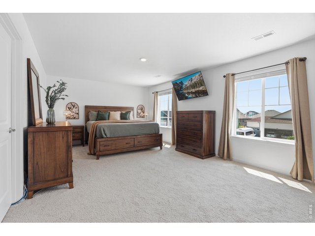 Property Photo 16 Expansive primary suite easily fits a king set with room to spare.