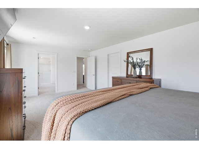 Property Photo 17 Private primary retreat with an en-suite bath and generous walk-in closet.