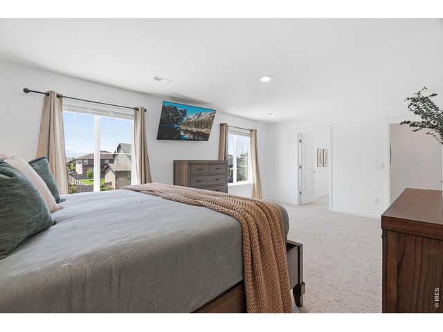 Property Photo 18 Take in the breathtaking mountain views from your primary bedroom windows!