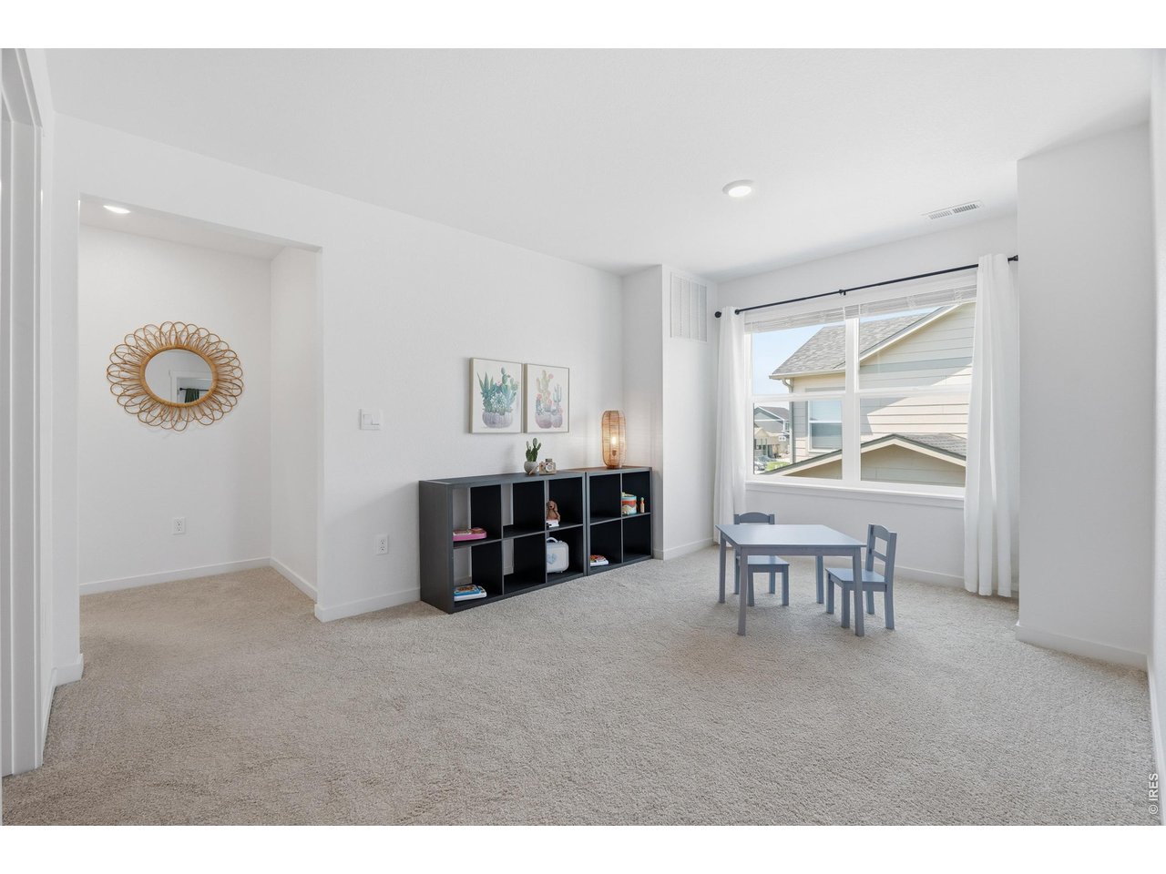 Property Photo 23 Versatile upstairs loft offers bonus living space for a playroom, media area, or second family room.