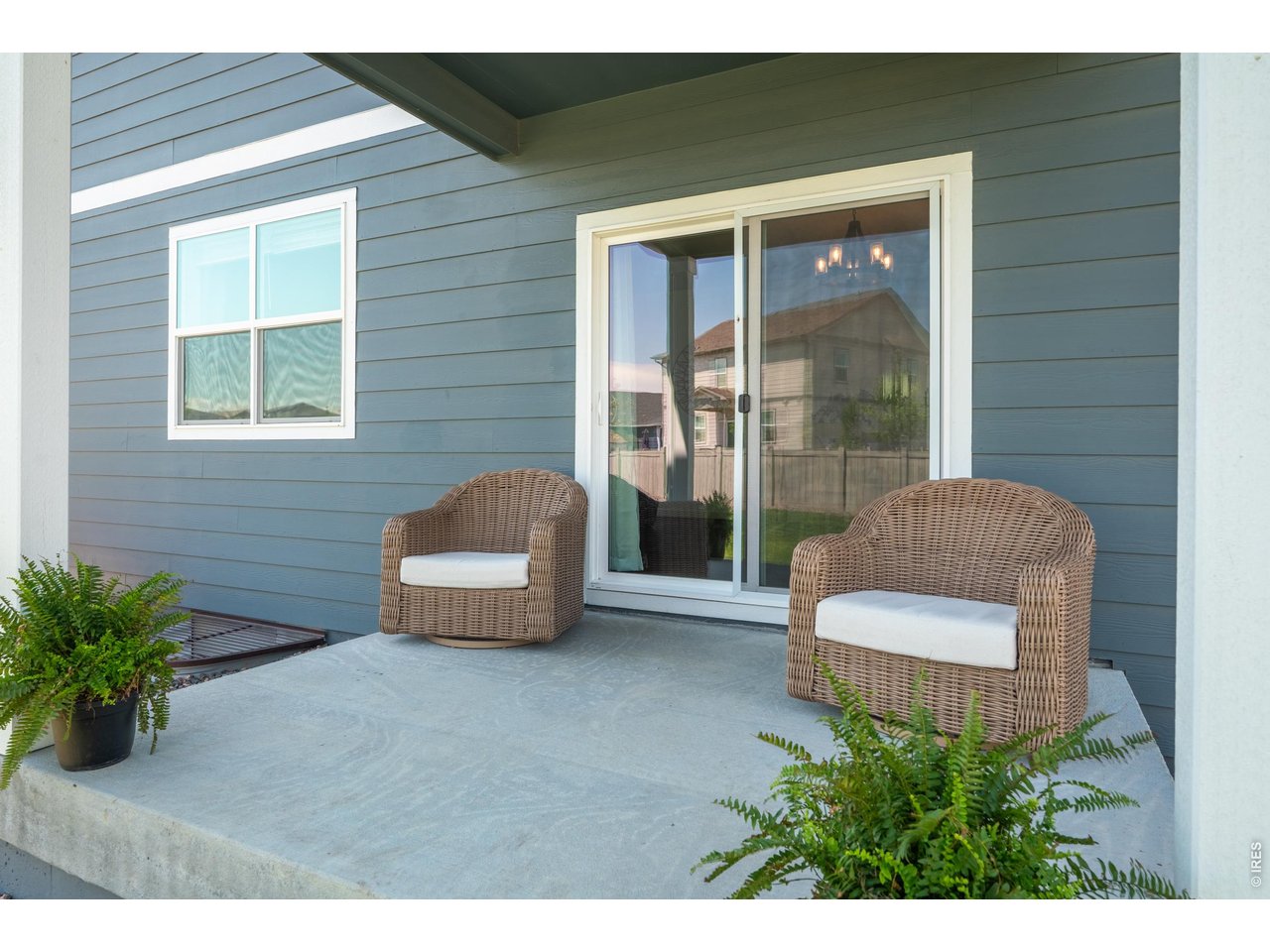 Property Photo 33 Shaded back porch with a slider to the living area makes morning coffee and evening unwinding effortless.