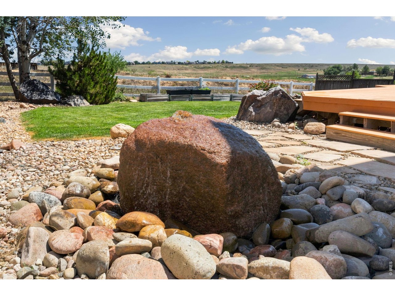 Property Photo 27 Wonderful landscaping with a peacful low-maintenance water feature