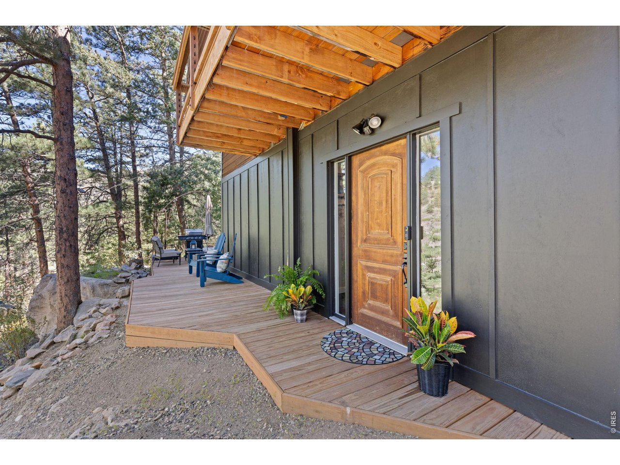 Property Photo 3 Distinctive wood entry door with full-length sidelights welcomes you home.