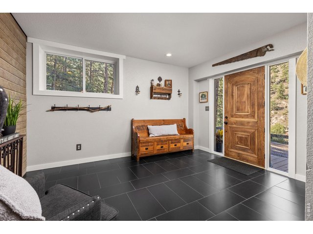 Property Photo 6 Spacious entry mudroom creates a welcoming and functional arrival.