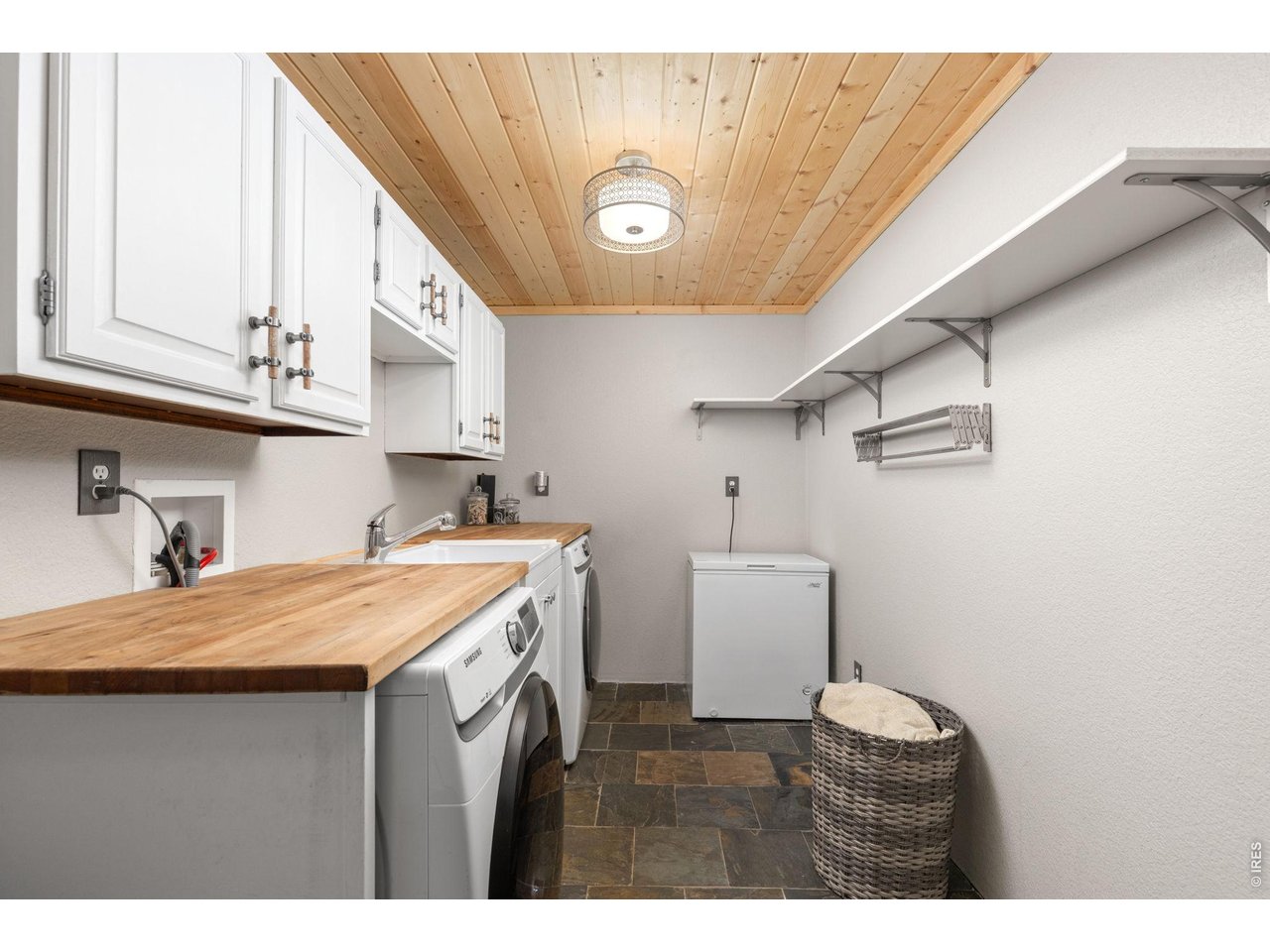 Property Photo 8 Dedicated laundry room conveniently located just off the entry mudroom.
