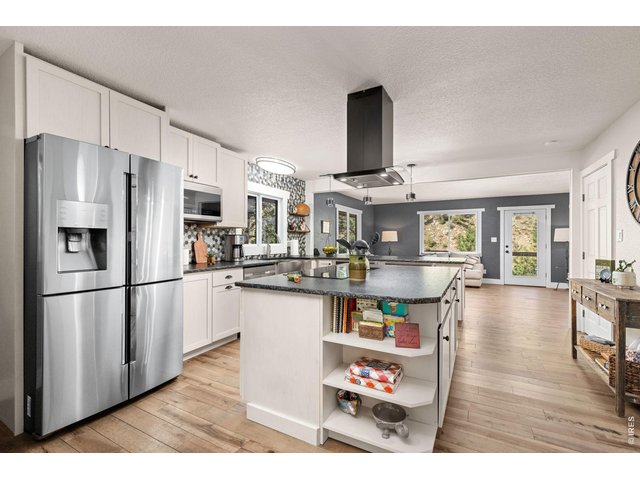 Property Photo 15 Open kitchen and living spaces showcase the home's extensive recent improvements.