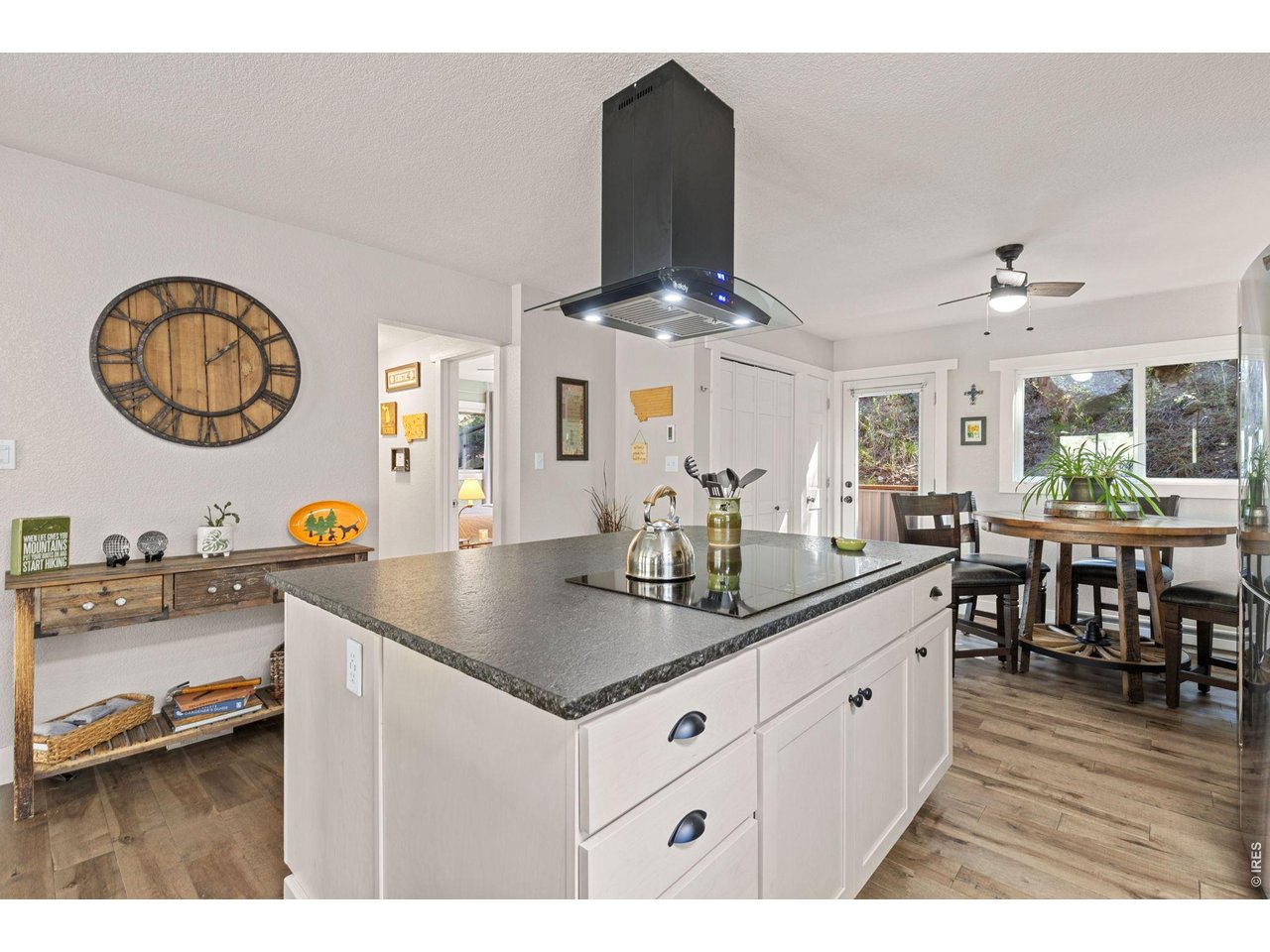 Property Photo 13 Generous kitchen island and wide-plank 3/4-inch solid maple flooring.