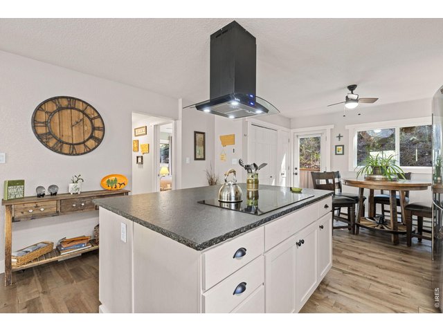 Property Photo 13 Generous kitchen island and wide-plank 3/4-inch solid maple flooring.
