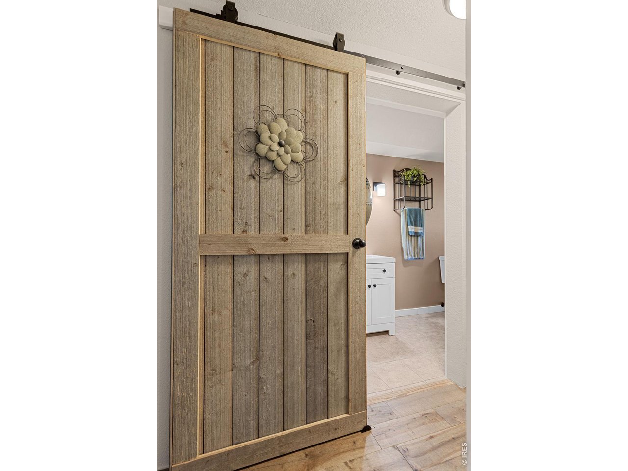 Property Photo 22 Sliding barn doors add character to the main-level full bathroom.