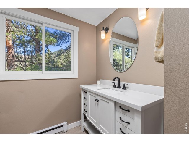 Property Photo 29 Upper-level bath features a generous vanity with ample counter space and storage.
