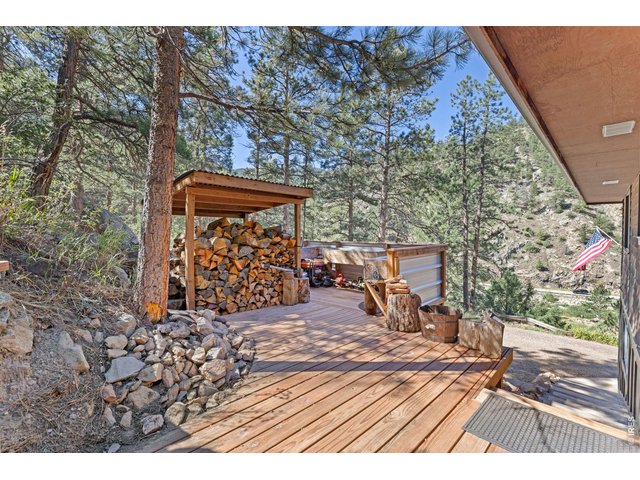 Property Photo 36 Tucked behind the home, an additional deck area provides useful outdoor space surrounded by the canyon setting.
