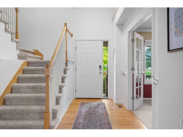 Property Photo 3 Bright entry with the office as you enter