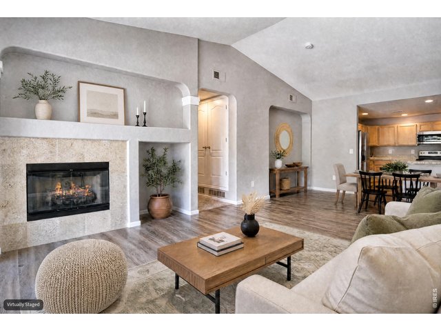 Property Photo 10 Living room features a gas fireplace.