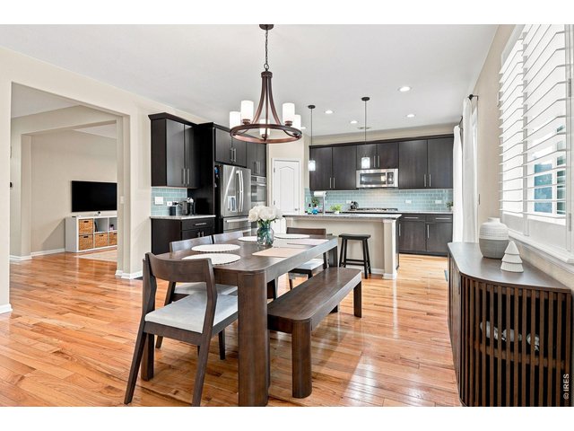 Property Photo 9 The gourmet kitchen is designed for both cooking and entertaining, featuring a gas cooktop, double ovens, upgraded refrigerator, large island, abundant cabinetry, pantry, and a comfortable eat-in area