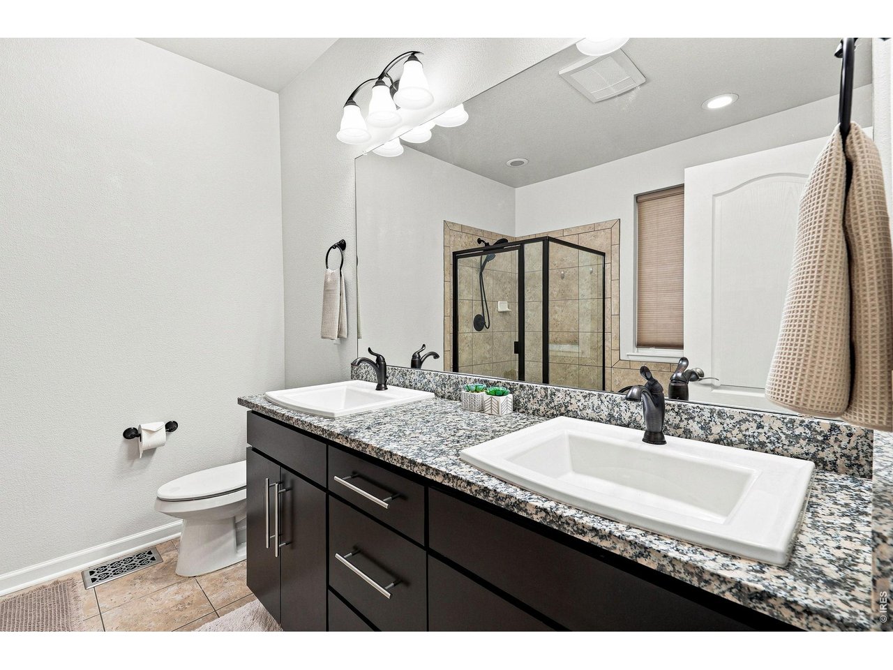 Property Photo 21 Luxurious primary suite features a custom walk-in closet and an upgraded five-piece bath, creating a relaxing retreat