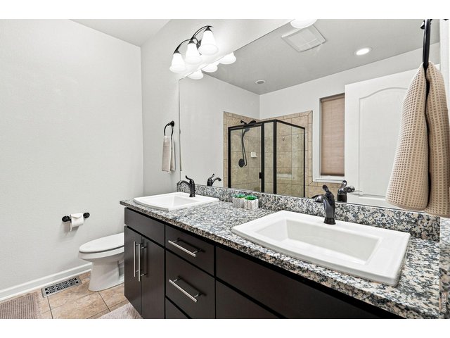 Property Photo 21 Luxurious primary suite features a custom walk-in closet and an upgraded five-piece bath, creating a relaxing retreat