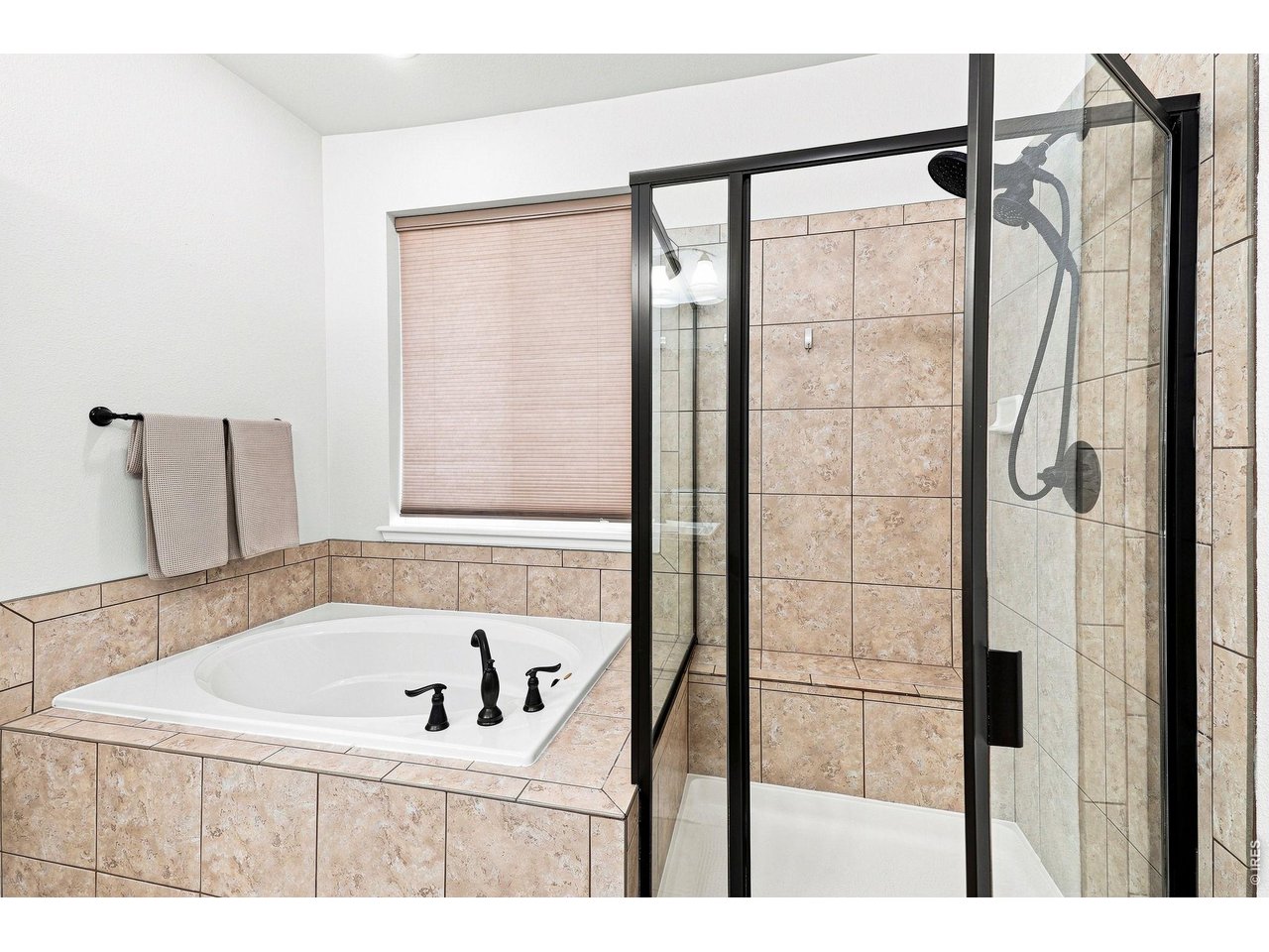 Property Photo 22 Luxurious primary suite features a custom walk-in closet and an upgraded five-piece bath, creating a relaxing retreat