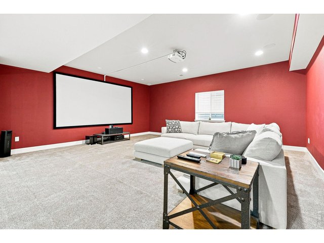 Property Photo 31 Basement theater room with a 139-inch screen and surround sound