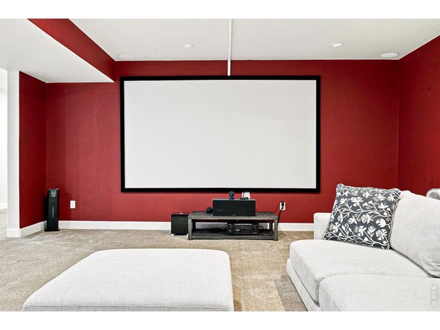Property Photo 32 Basement theater room with a 139-inch screen and surround sound