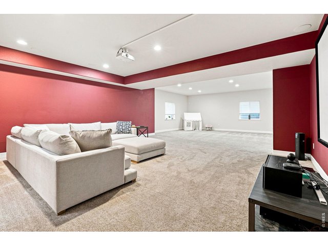 Property Photo 33 Basement theater room with a 139-inch screen and surround sound
