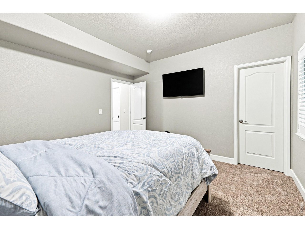 Property Photo 35 Basement fourth bedroom with a walk-in closet and three-quarter bath