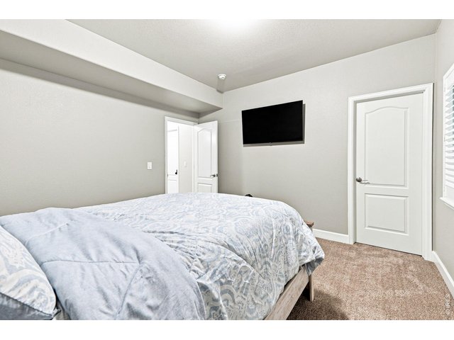 Property Photo 35 Basement fourth bedroom with a walk-in closet and three-quarter bath