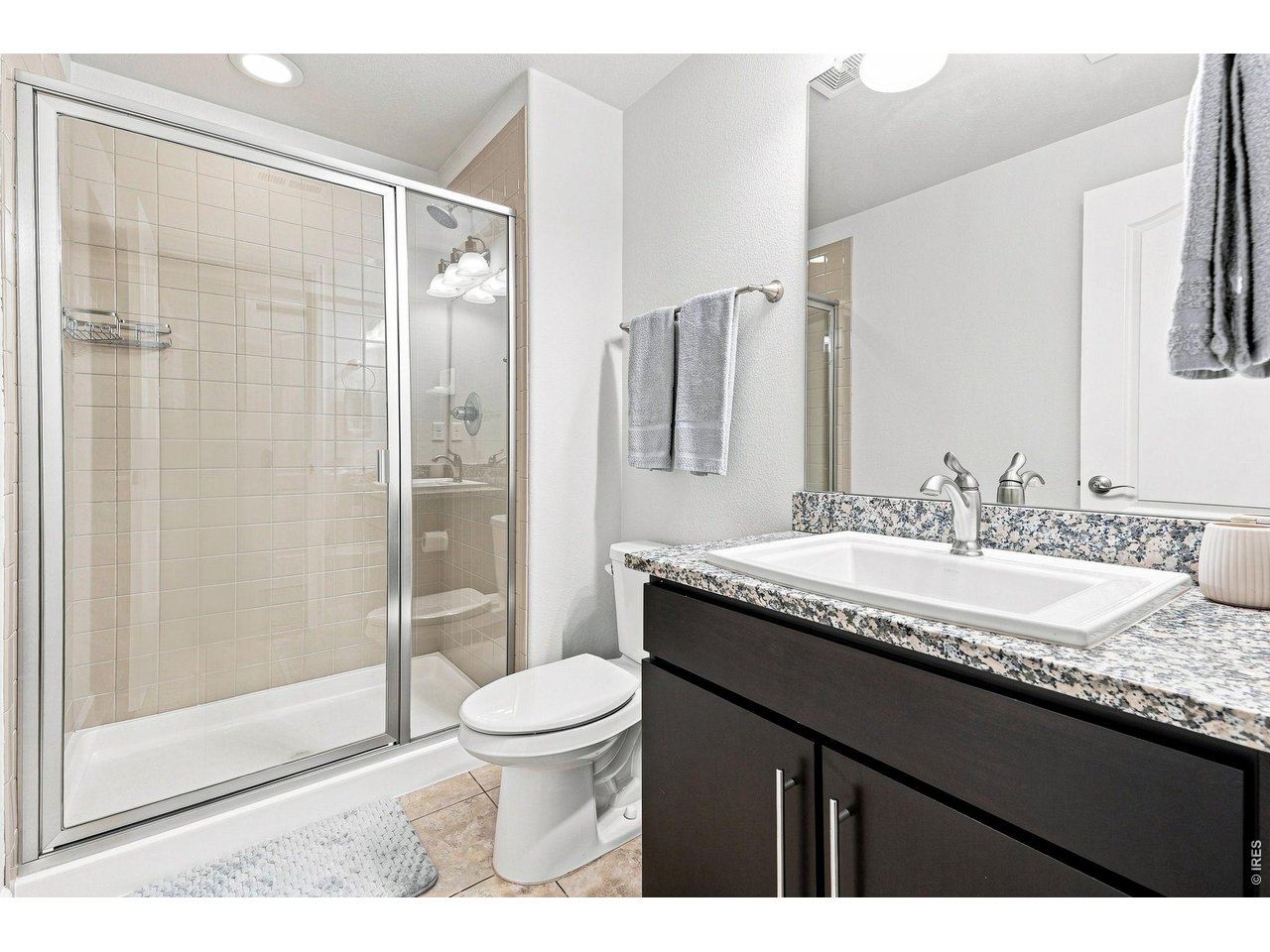 Property Photo 36 Basement fourth bedroom with a walk-in closet and three-quarter bath