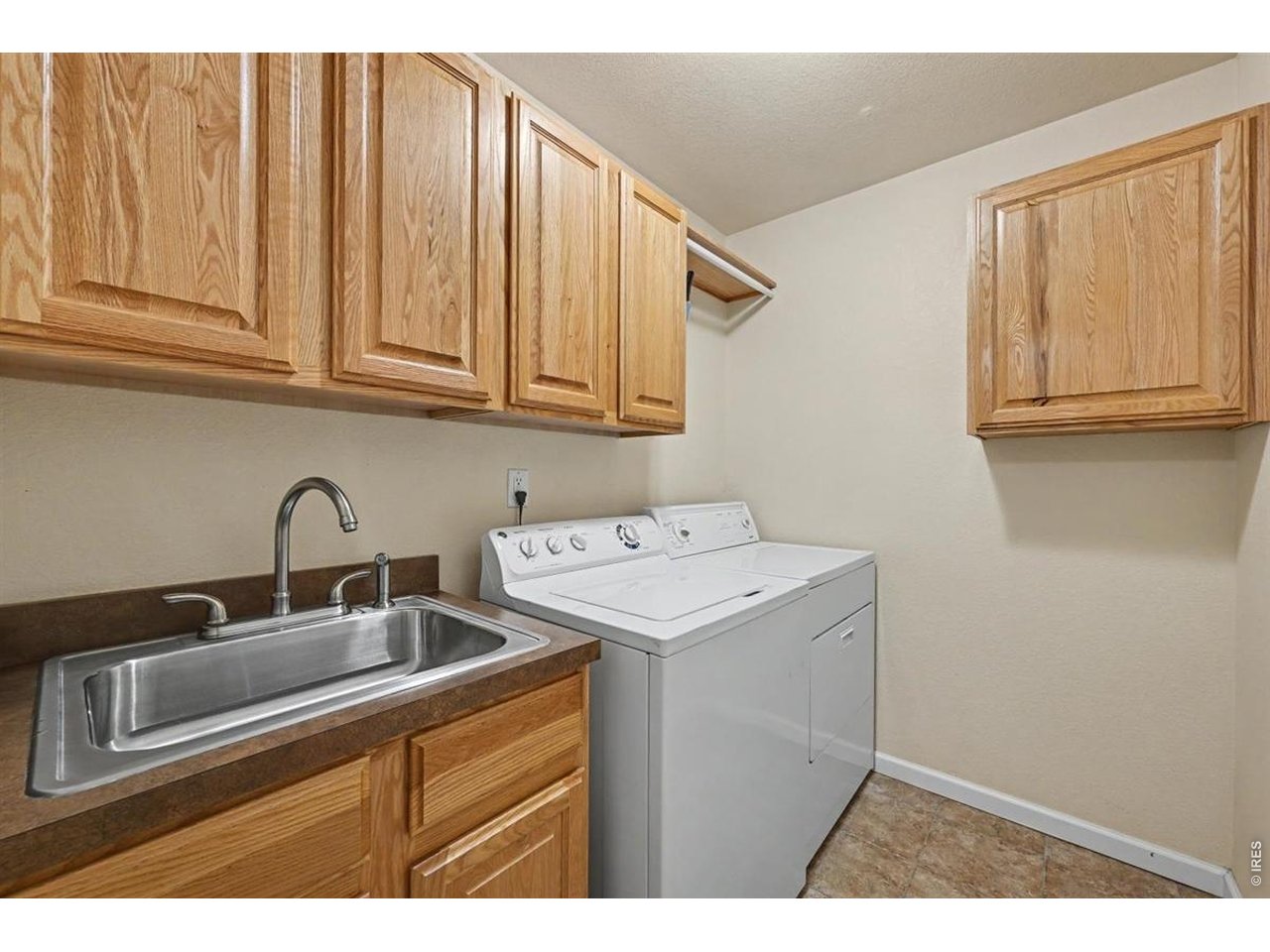 Property Photo 35 Spacious Main-Floor Laundry Room with Convenient Soaker Sink