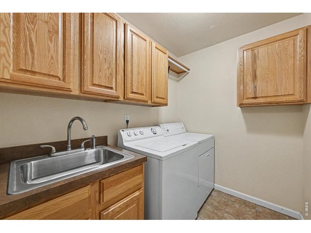 Property Photo 35 Spacious Main-Floor Laundry Room with Convenient Soaker Sink