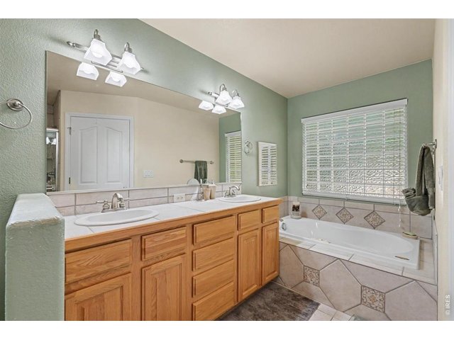 Property Photo 17 Spa-Like Primary Bath with Jetted Tub and Generous Walk-In Closet
