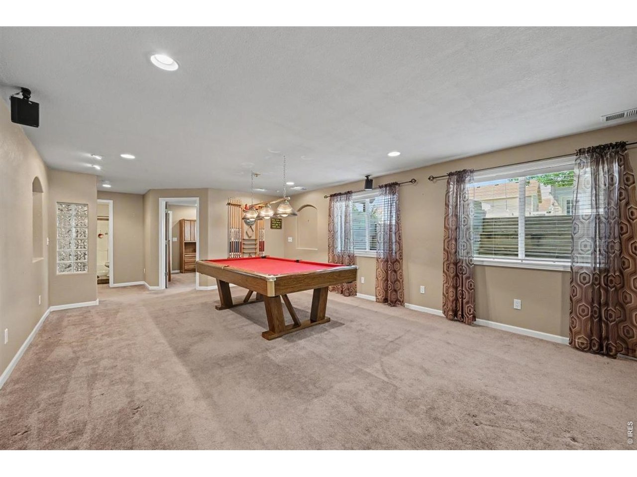 Property Photo 25 Game-On Basement with a Full-Size Pool Table