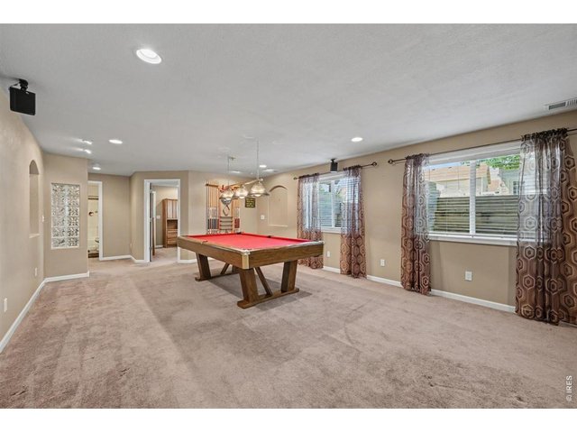 Property Photo 25 Game-On Basement with a Full-Size Pool Table