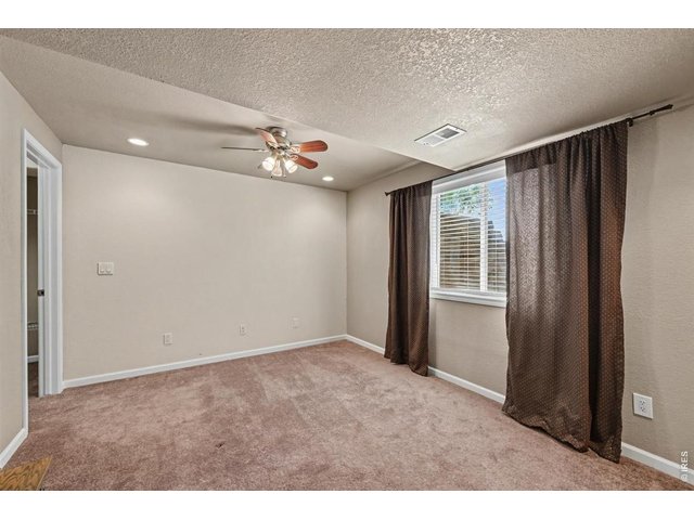 Property Photo 30 Spacious Lower-Level Bedroom That Feels Bright and Inviting