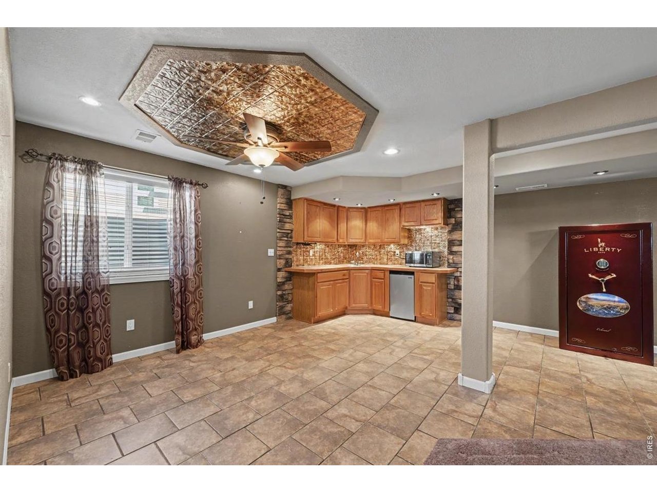 Property Photo 8 Lower-Level Wet Bar with a Unique Tin-Accent Ceiling