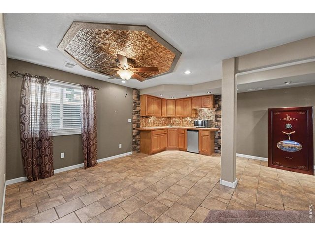 Property Photo 8 Lower-Level Wet Bar with a Unique Tin-Accent Ceiling