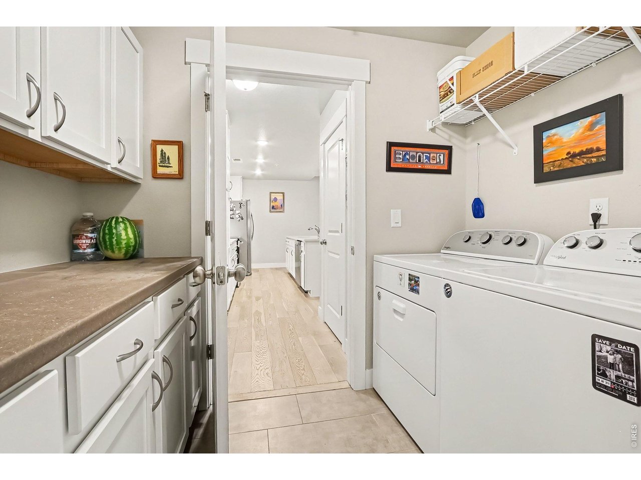 Property Photo 13 Large laundry room with storage cabinets and work area counters