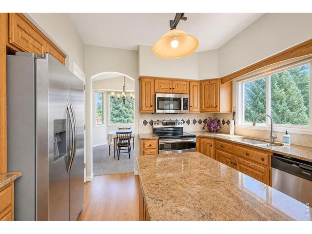 Property Photo 17 Upgraded cabinets and granite