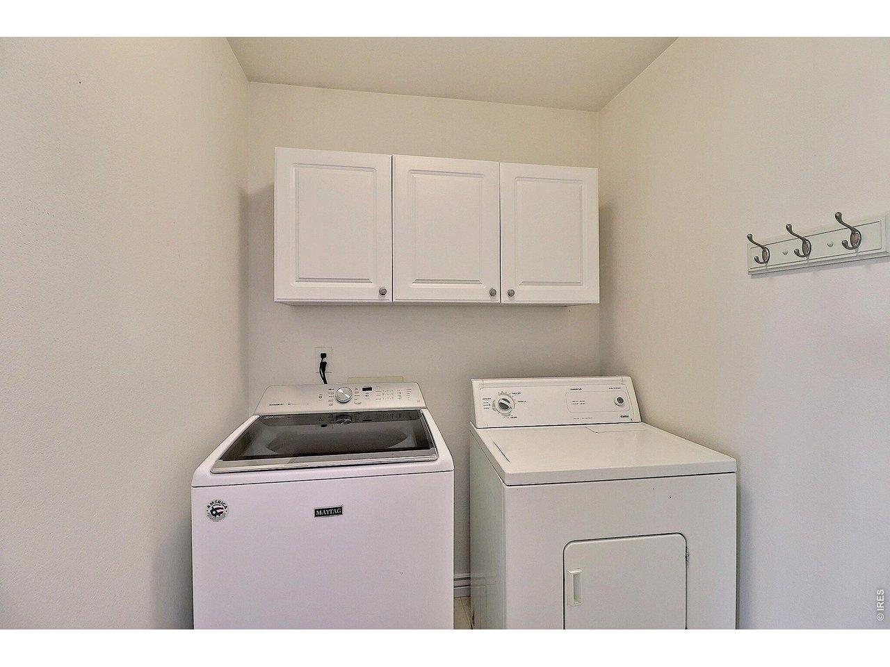 Property Photo 17 Laundry Room Off Kitchen Includes Washer and Dryer