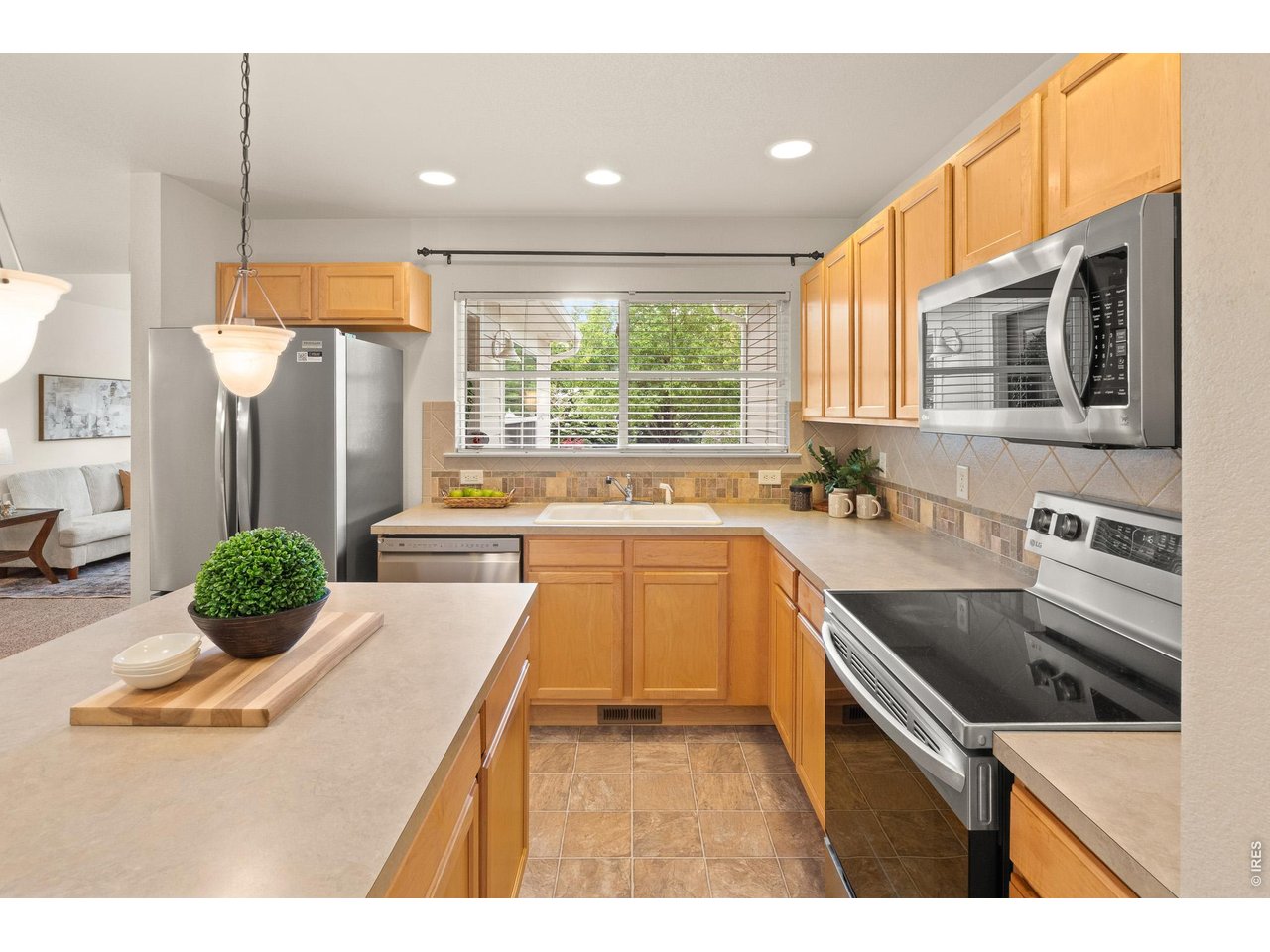 Property Photo 8 A lovely island for all your cooking needs, SS appliances and the almost brand new refrigerator stays too!