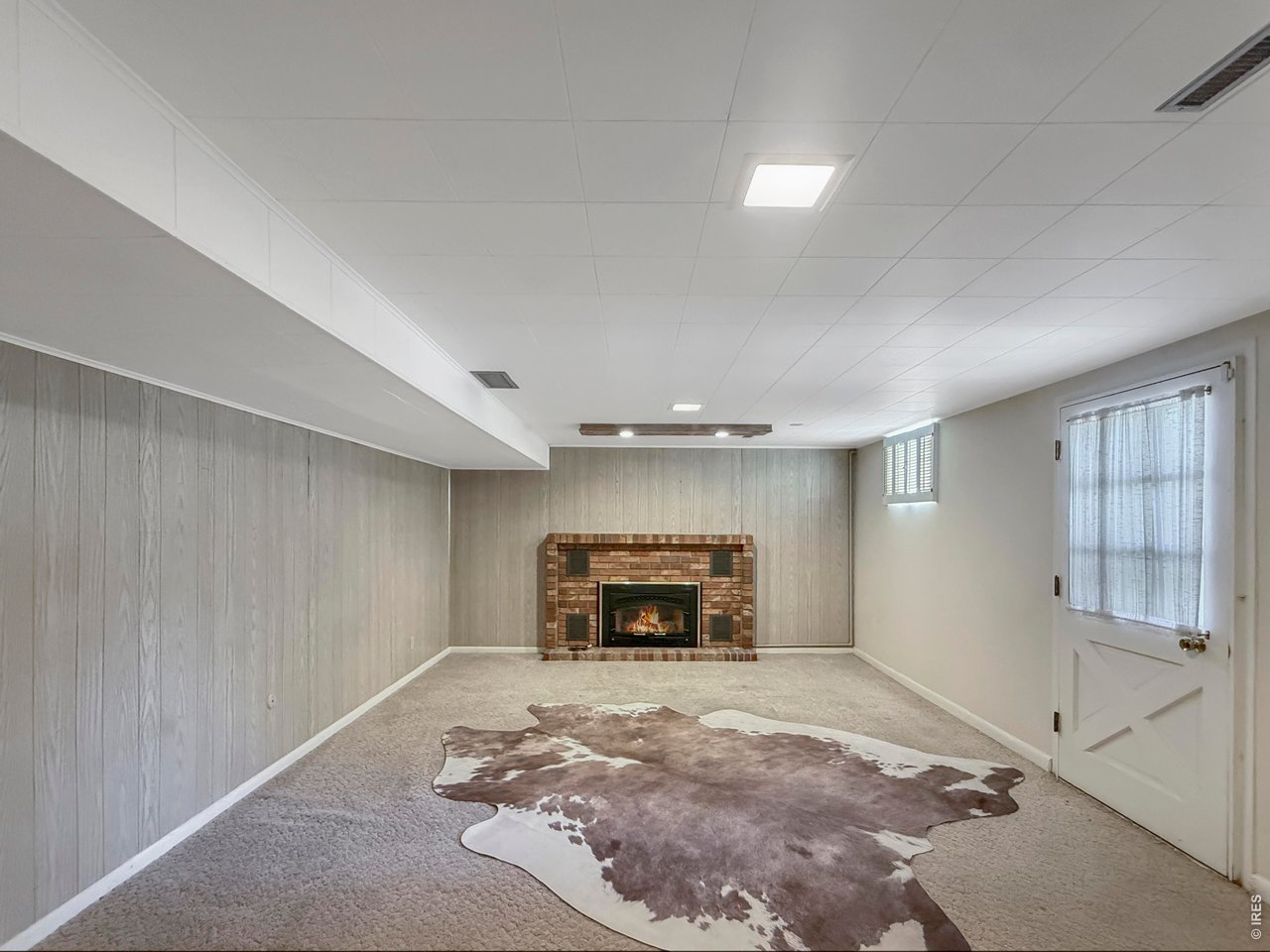 Property Photo 31 Family Room (Stain under cow hide)