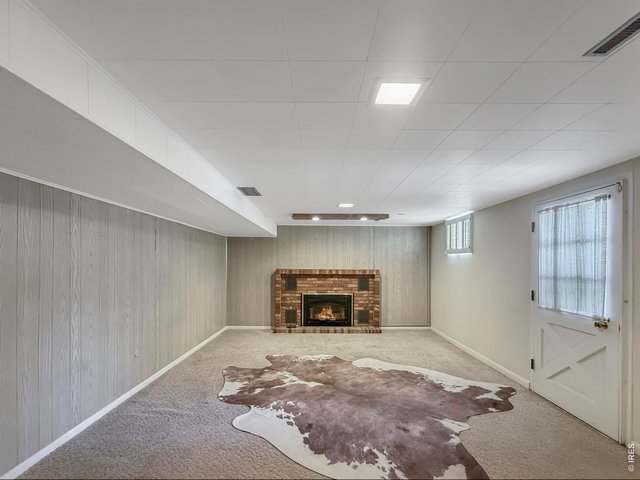 Property Photo 31 Family Room (Stain under cow hide)