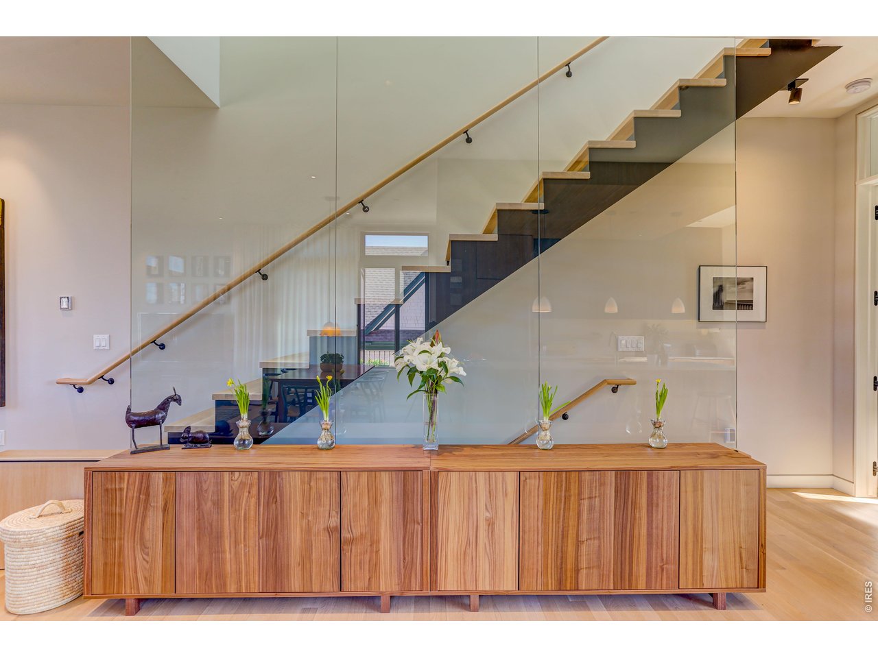 Property Photo 9 *Similar floor plan, finishes and feel at L'Avenir! Not of the actual build. Full glass wall, white oak floors - architecturally stunning - floating staircase. Smooth wall texture, 10 FT ceilings on the living level!
