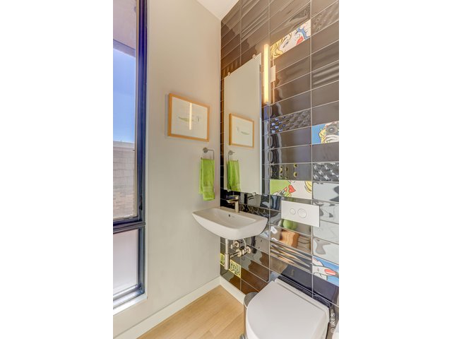 Property Photo 4 Powder Bathroom on the living level *Similar floor plan, finishes and feel at L'Avenir! Not of the actual build.