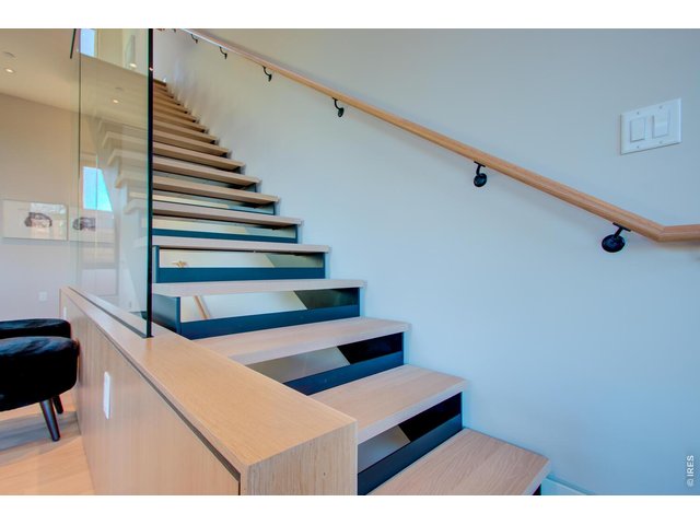 Property Photo 3 Stunning Floating staircase from Living Level to Sleeping Level. *Similar floor plan, finishes and feel at L'Avenir! (Picture is not of the actual build)