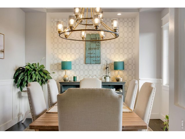 Property Photo 11 bespoke chandelier and classic wainscoting throughout dining room.