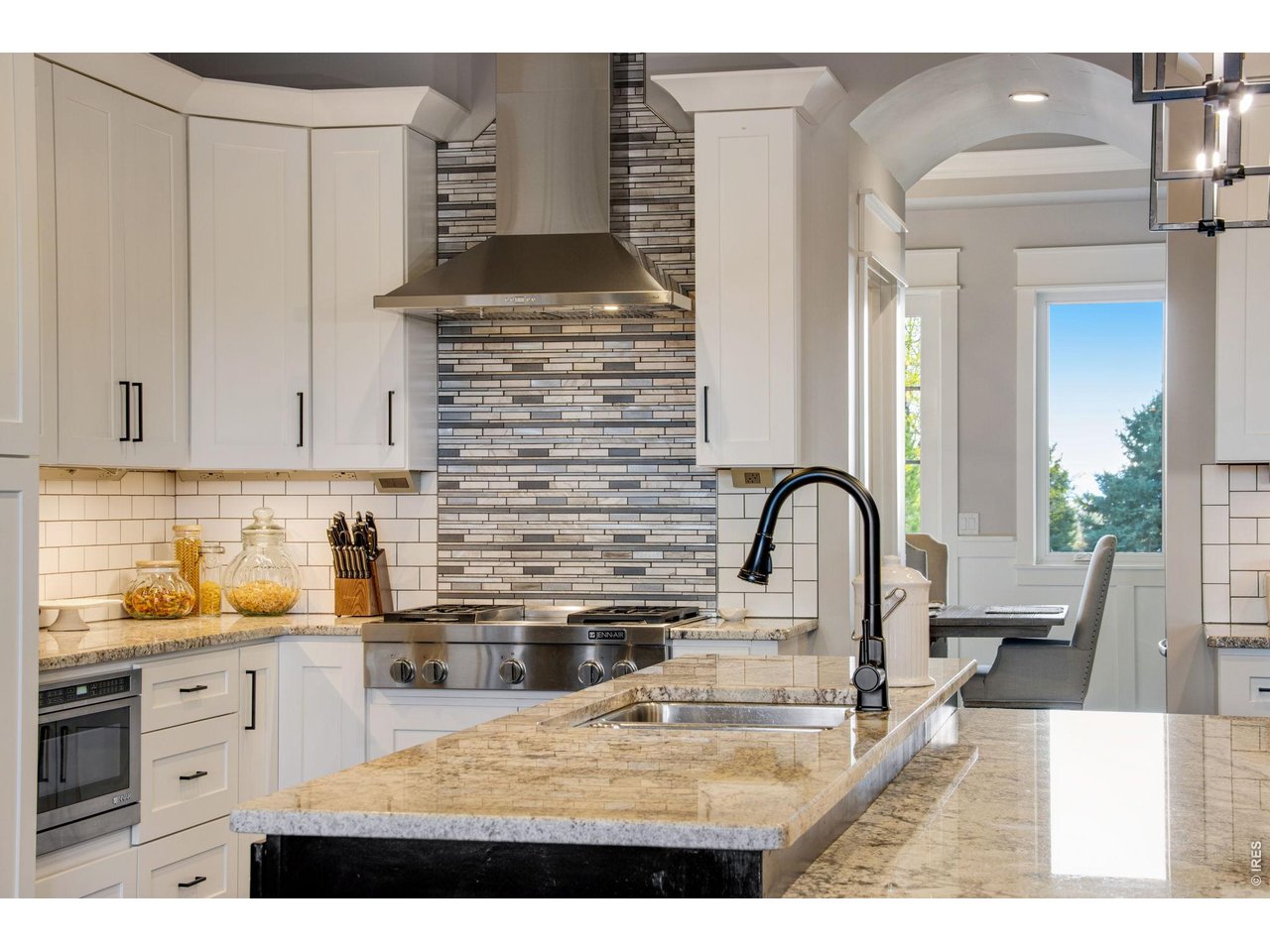 Property Photo 18 Kitchen flows well through butler's hall to pantry with expansive countertop space.