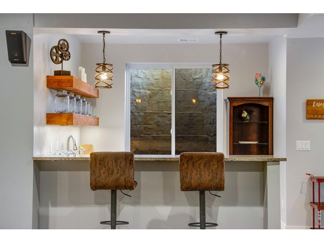 Property Photo 36 Wet bar with dishwasher and beverage refrigerator.