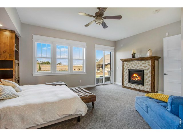 Property Photo 27 Gas fireplace, sliding glass door to back patio, hot tub.