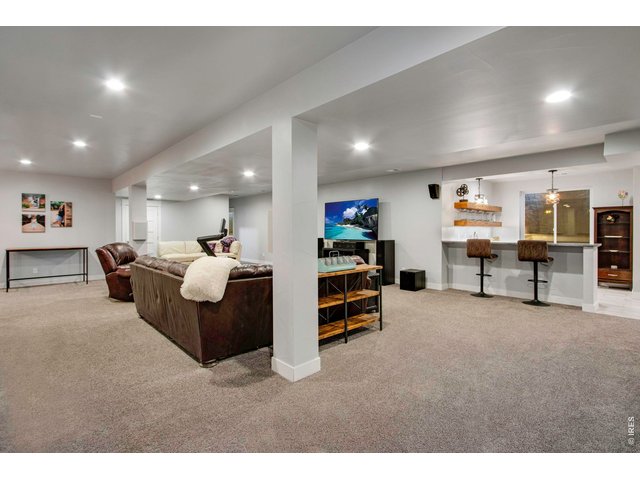 Property Photo 34 Large insulated theater sound basement and wet bar.