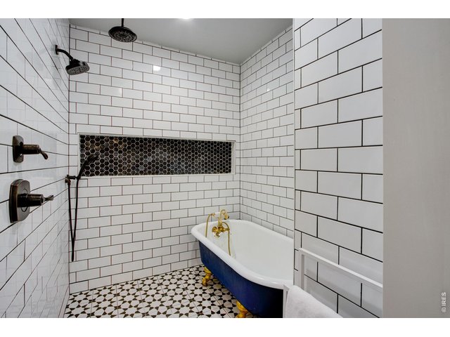 Property Photo 39 Floor to ceiling custom tile, cast iron clawfoot tub.